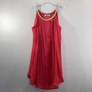 Deep coral sundress fully lined with gold rope shoulder straps.